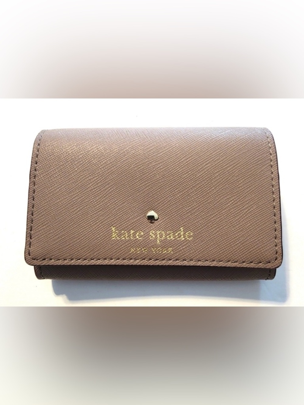 This is a Kate Spade Mikas Pond Christine leather small wallet in Oyster color